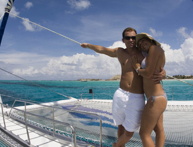 couple in a catamaran in sea passion