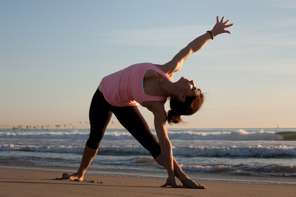 Yoga on the beach - photo by lauryshark Relax with a class of yoga or pilates