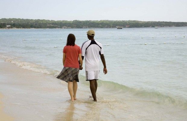 Couple walking on the beach in Negril