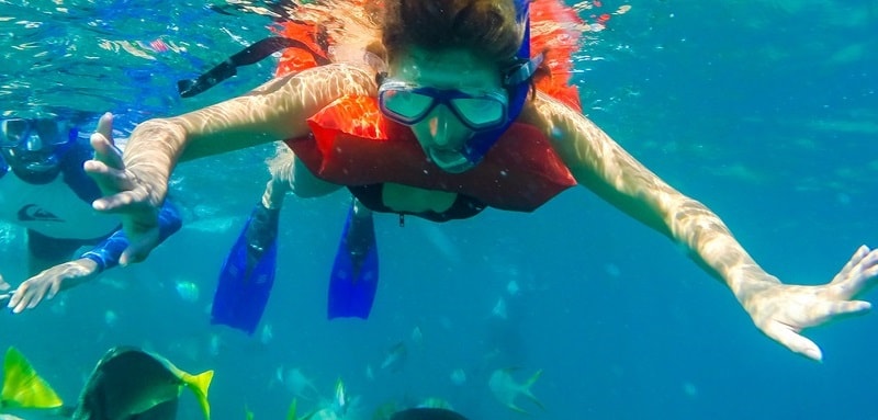 Women snorkeling near Lovers Beach