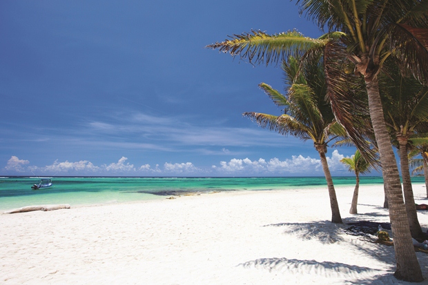 The white sand extending out into the Caribbean Sea at the beach in Tulum, Mexico