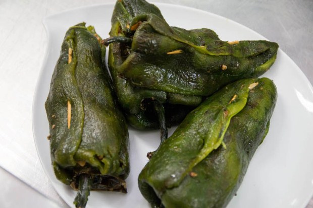 Stuffed poblano peppers waiting to be fried