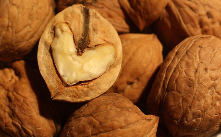 The inside of a walnut that is shaped like a heart