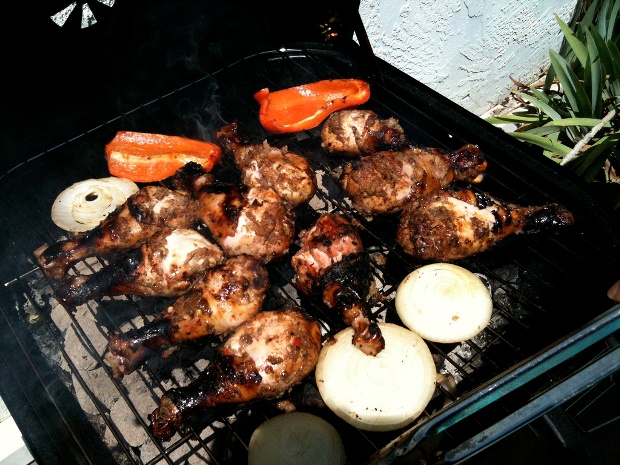 A grill filled with delicious jerk chicken in Jamaica