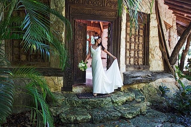 A bridal model outside the rustic door of a traditional hacienda in the Riviera Maya, Mexico