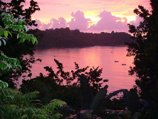 The sun falls in Costa Rica, covering the Pacific Sea in a violet hue