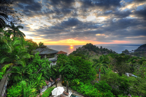 A gorgeous view off the coast of Costa Rica as the sun falls into the sea-