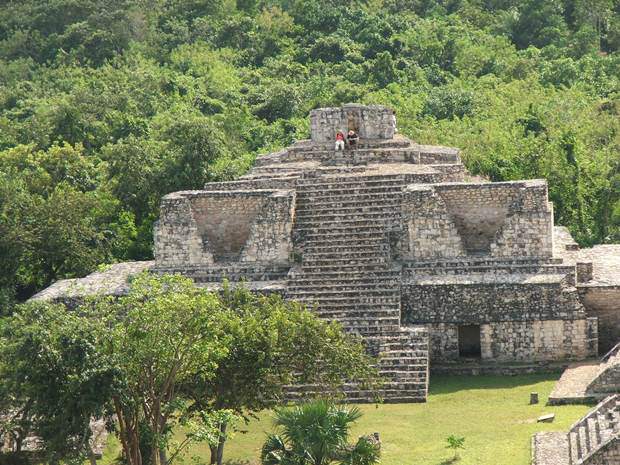 A couple resting atop one of the pyramids on the Ek Balam tour in the Yucatan Peninsula, Mexico