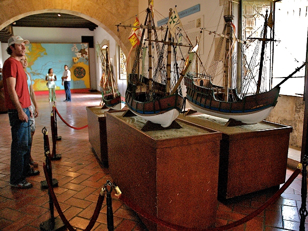 Tourists admiring models of the ships of Spanish conquistadors at a museum in Santo Domingo, Dominican Republic