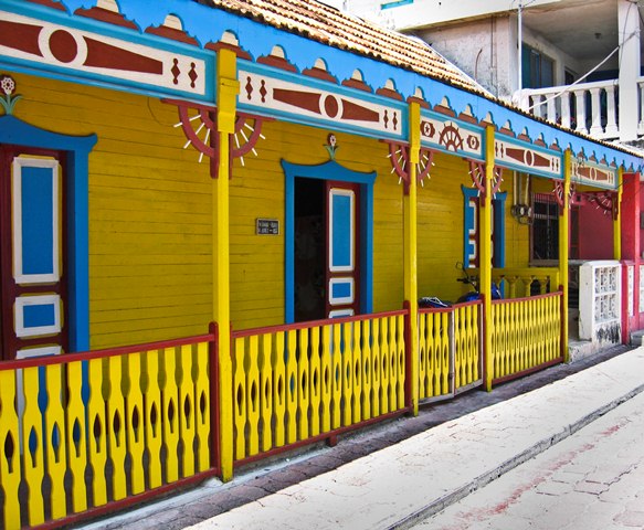 A colorful yellow and blue painted house on Isla Mujeres, Mexico