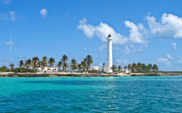 Contoy Island lighthouse as seen from the Caribbean Sea on the Contoy Island tour