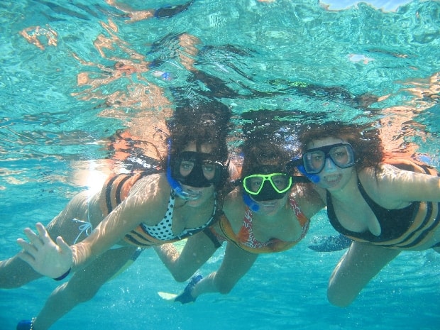 A group snorkeling in the Caribbean Sea