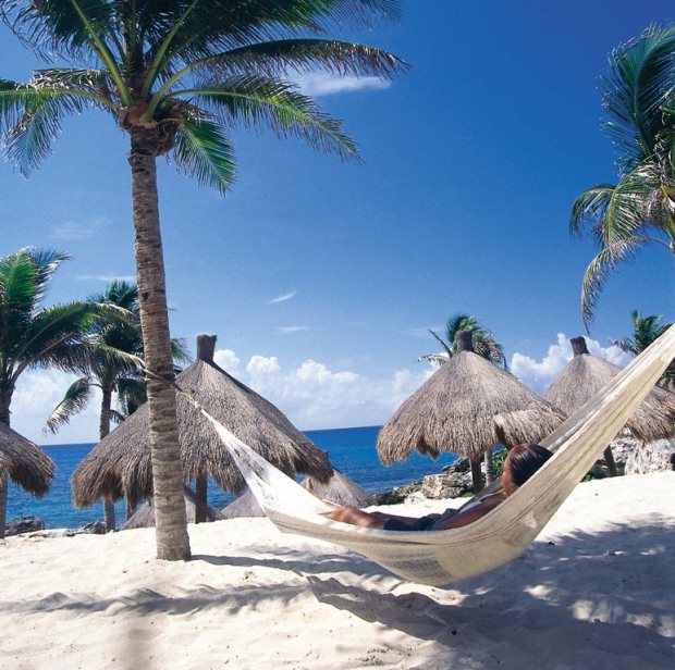 Relaxing on a hammock overlooking the Caribbean Sea on the Amstar dmc tour of Xcaret Park