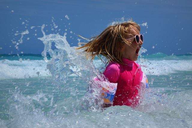 A child splashes around in the Caribbean Sea at Bayahibe beach in La Romana, Dominican Republic