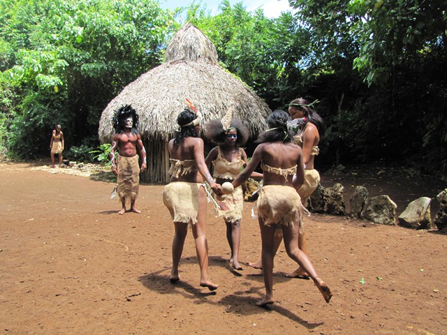 Actors at the Taino village replica perform a dance for tourists