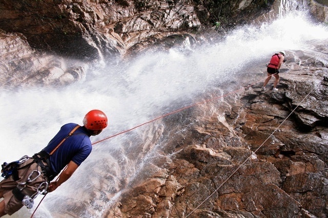 Adventurers rappel down a waterfall in Vallarta