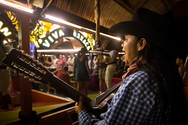 A musician sings a ranchera song at Xoximilco Park in Mexico's Riviera Maya