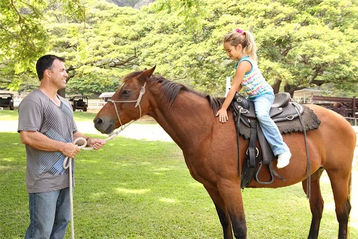 Child on a horse at Kualoa Ranch