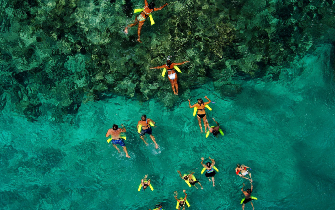 a group of people snorkeling in Punta Cana