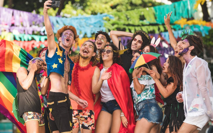 Group of friends taking a selfien on a LGBT+ Event