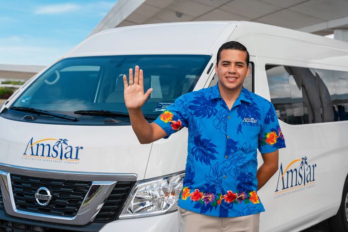 Amstar Driver Greeting Clients at the Airport