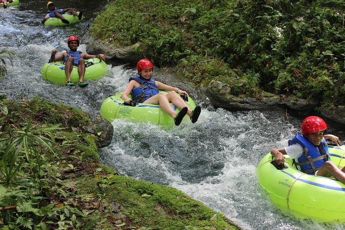 People going down a river in a Jamaican Excursion