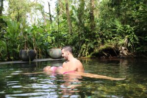 A couple swimming in Hot Springs, Costa Rica