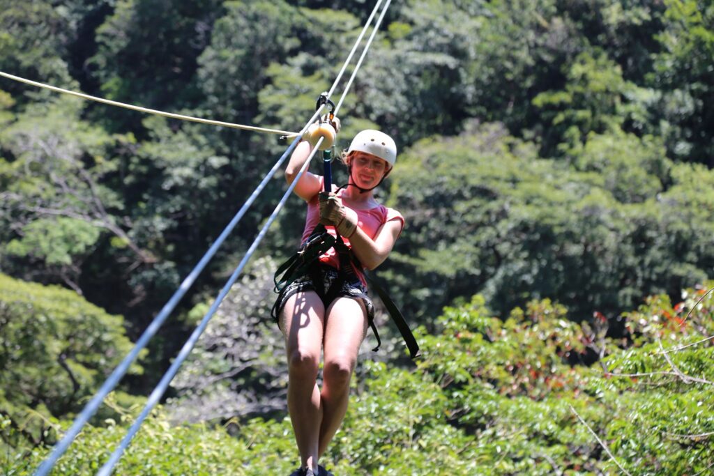 Woman ziplining in the Mega Combo tour in Costa Rica