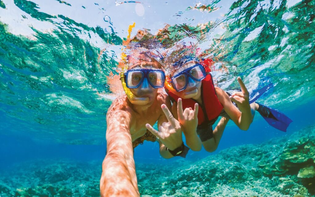 Two people snorkeling on the reef in Jamaica.