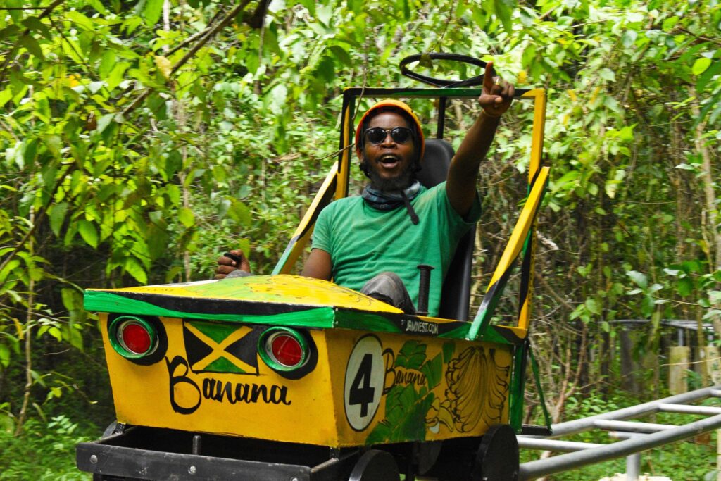 A man riding a "banana" cart in the Jamwest Adventure Park