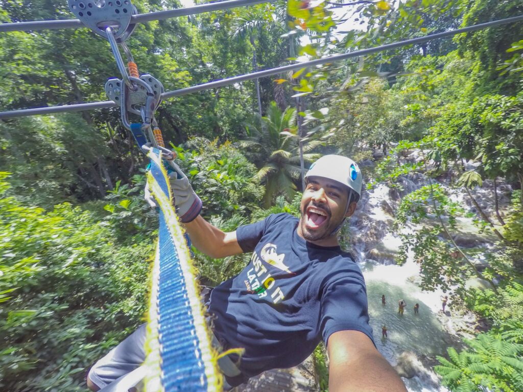 Man soaring in a zipline from Chukka in Jamaica