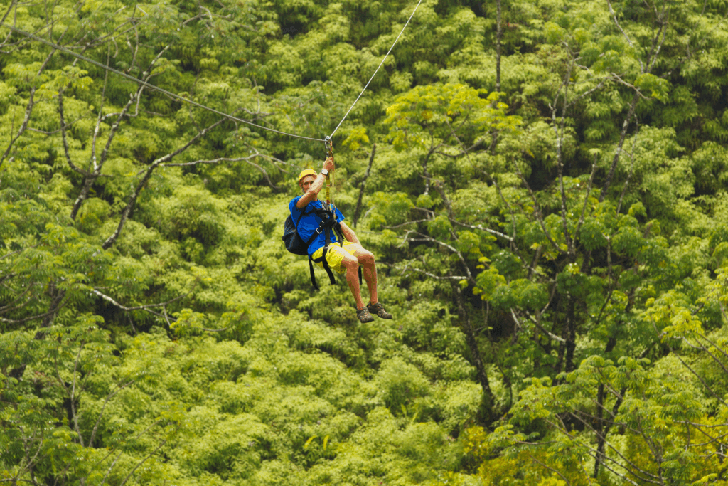 A person enjoying a zipline activity in the natural landscapes of Hawaii.