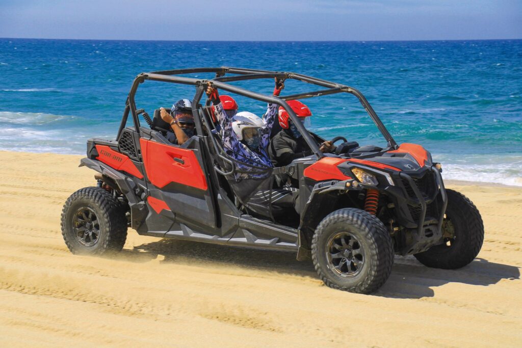 Friends on ATV adventure in the desert of Los Cabos, Mexico.