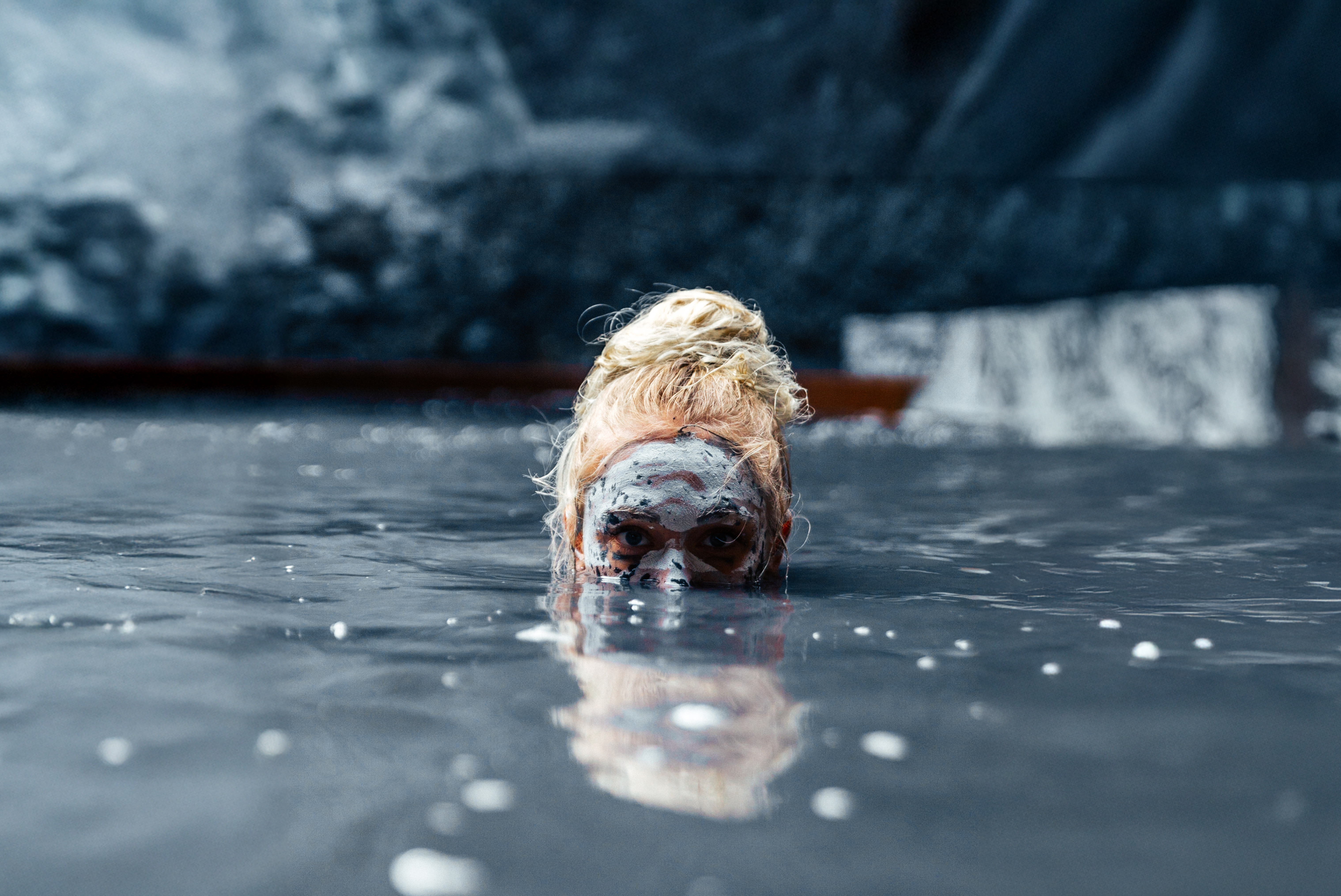 A woman in a mud bath