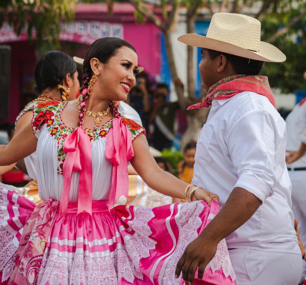 A couple dancing a traditional Mexican dance