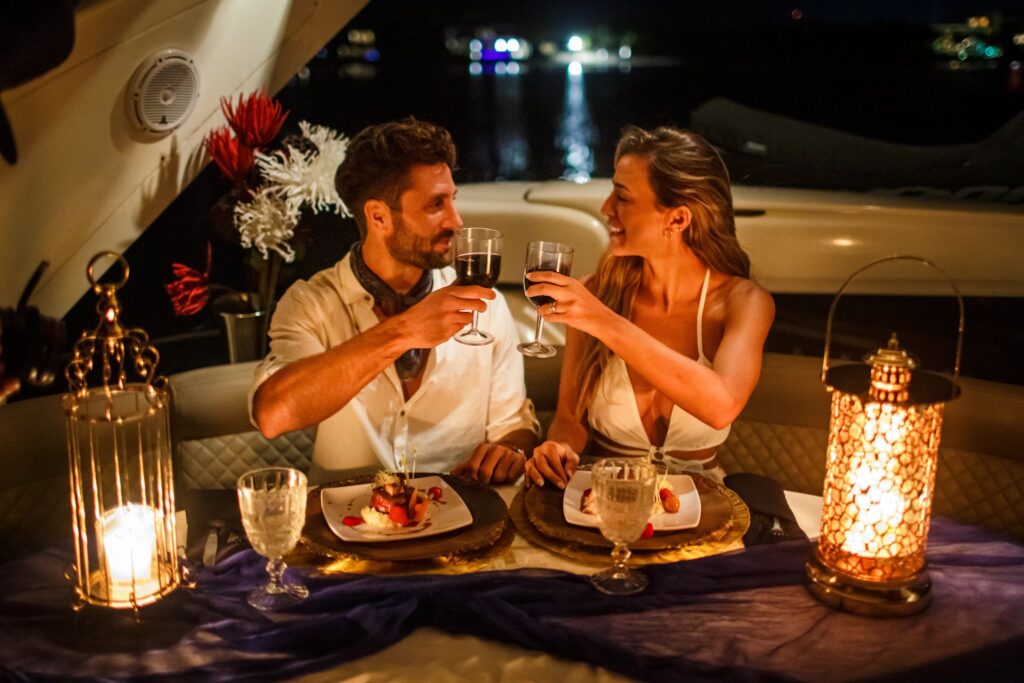 Couple enjoying a romantic dinner on a luxury yacht in Cancun