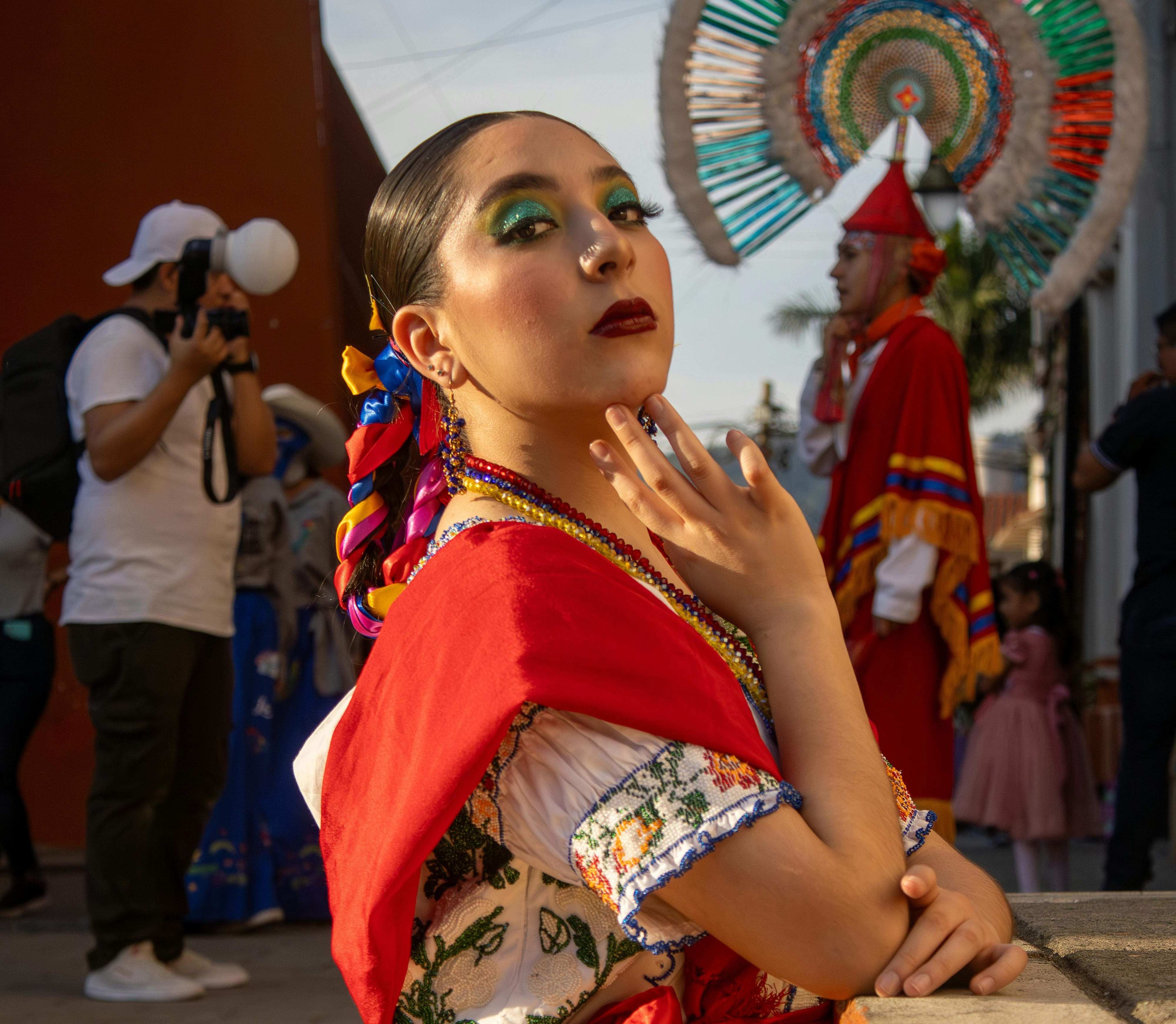 A Woman in Traditional Clothing Standing on a Street