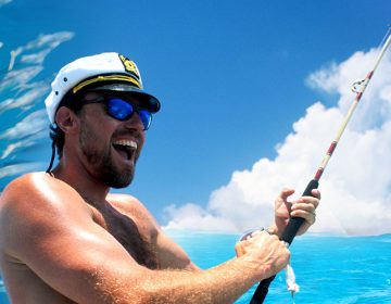 A man fishing happily in Cancun